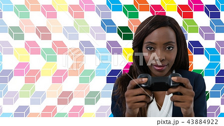 Woman playing computer game with colorful geometric pattern Woman playing computer game with colorful geometric pattern 43884922