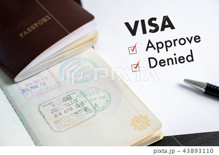 Visa and passport to approved stamped on a Visa and passport to approved stamped on a 43893110