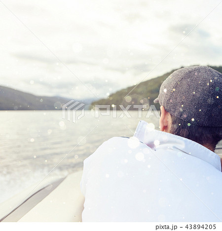 Man with gray cap looking to mountains Man with gray cap looking to mountains 43894205