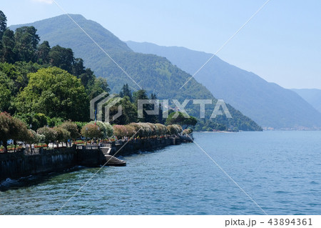 Lake Como in a sunny day with shore on side Lake Como in a sunny day with shore on side 43894361