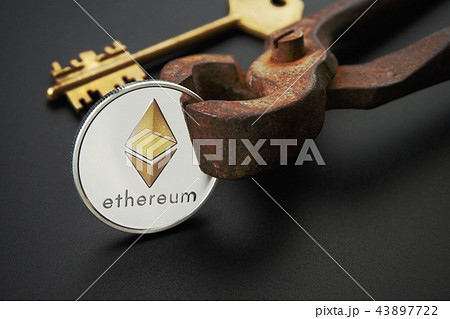 Ethereum coin golden key and rusty vintage nippers Ethereum coin golden key and rusty vintage nippers 43897722