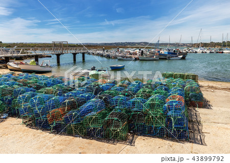 Fishing traps for fish and octopuses with views of Alvor. Portugal Fishing traps for fish and octopuses with views of Alvor. Portugal 43899792