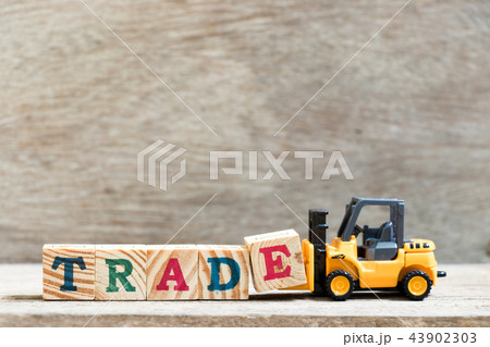Toy forklift hold letter block E in word trade Toy forklift hold letter block E in word trade 43902303