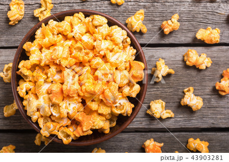 Yellow cheese popcorn in bowl Yellow cheese popcorn in bowl 43903281