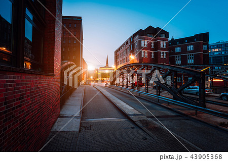Empty Poggenmuehlen Bridge at twilight. Hamburg, Germany. illuminated buildings and last sunrays 43905368