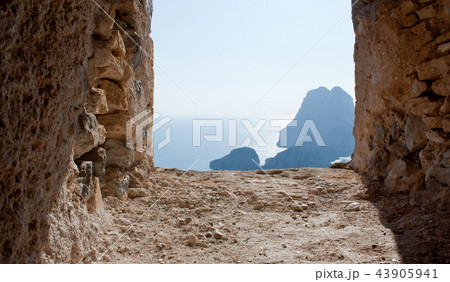 Es Vedra trough the window of tower, Ibiza Es Vedra trough the window of tower, Ibiza 43905941