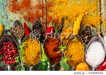 Various colorful spices on wooden table Various colorful spices on wooden table 43909593