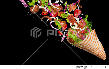 Kebab sandwich with flying ingredients. 43909621