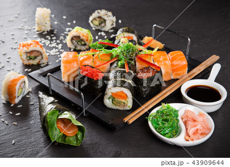Japanese sushi set on a rustic dark background. 43909644