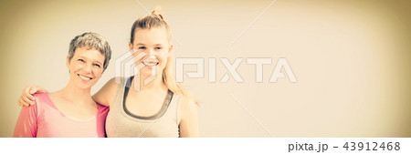 Sporty mother and daughter smiling Sporty mother and daughter smiling 43912468