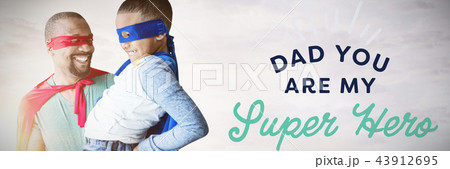 Composite image of father and son pretending to be superhero 43912695