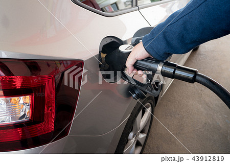 Closeup of man pumping diesel fuel. 43912819
