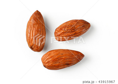 Top view on three almond nuts isolated on white 43915967