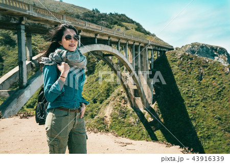 standing on the cliff in the mountains 43916339