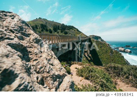 crag and mountains with train bridge 43916341