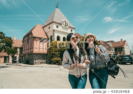 women sightseeing and walking cheerfully 43916468