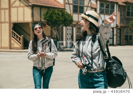 friends having sightseeing in an old lovely town 43916470