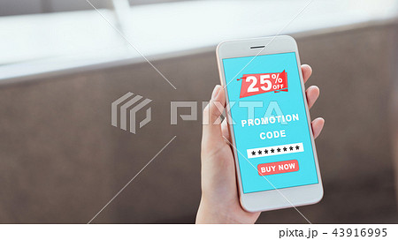 Women holding the smartphone to enter the code. 43916995