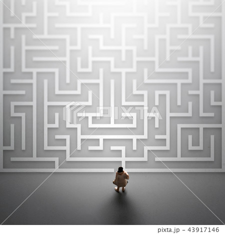 Miniature people entering a maze.  43917146