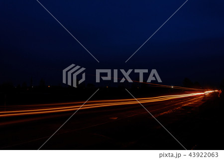 Headlights of cars, taken with long-term exposure to the background of the sky Headlights of cars, taken with long-term exposure to the background of the sky 43922063