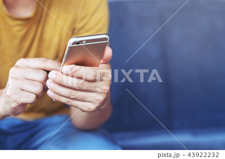 Young male using on cell phone 43922232