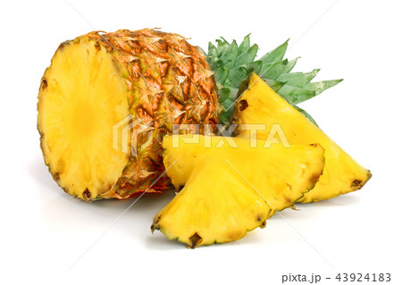 pineapple with slices isolated on white backgroundの写真素材