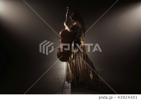 The cellist performs on stage. The cellist performs on stage. 43924301