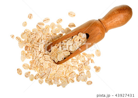 oat flakes in wooden scoop isolated on white background. Top view oat flakes in wooden scoop isolated on white background. Top view 43927431