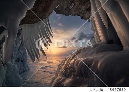 Crystal clear sharp icicles hanging down in frozen cave, lake Baikal 43927689