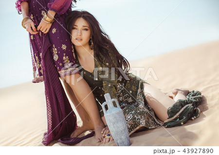 Thirsty women traveling in desert. Lost in desert durind sandshtorm 43927890
