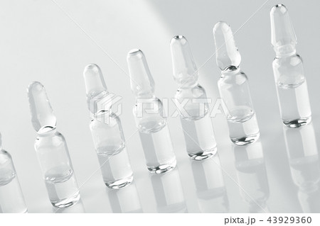 Ampoules with medicine on white background. 43929360