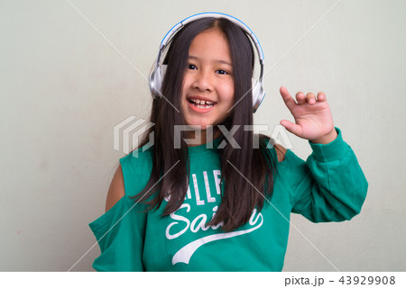 Portrait of young cute Asian girl wearing stylish clothes 43929908