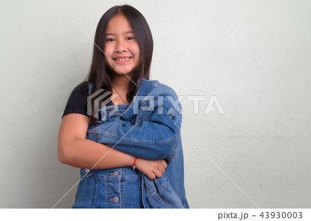 Portrait of young cute Asian girl wearing stylish clothes Portrait of young cute Asian girl wearing stylish clothes 43930003