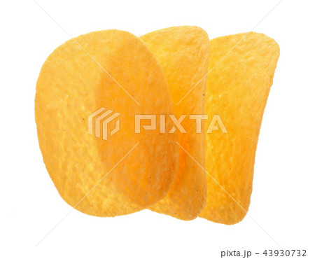 three potato chips on white background close-up. Top view. Flat lay three potato chips on white background close-up. Top view. Flat lay 43930732