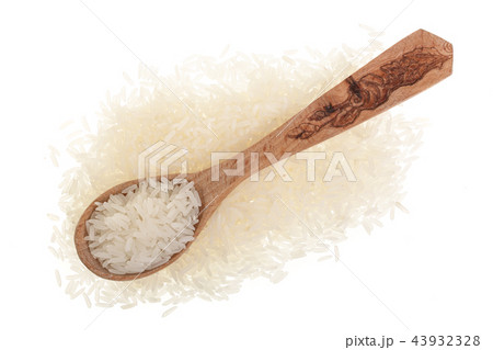 rice grains in wooden spoon isolated on white background. Top view. Flat lay rice grains in wooden spoon isolated on white background. Top view. Flat lay 43932328