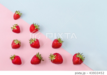 Bright ripe strawberry on a pastel background. Bright ripe strawberry on a pastel background. 43933452