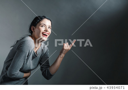 Young woman pointing at something Young woman pointing at something 43934071