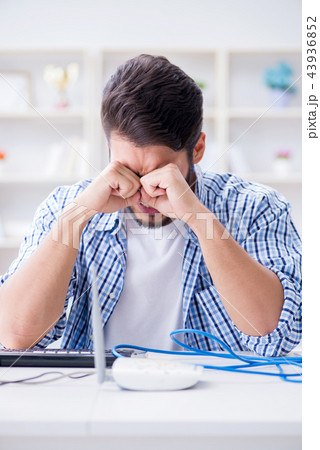 Frustrated young man due to weak internet reception 43936852