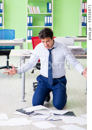 Frustrated businessman stressed from excessive work 43936871