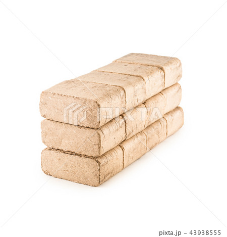 Wooden pressed briquettes from biomass on a white 43938555