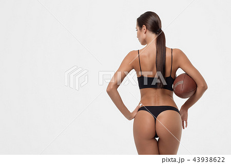 Slim lady booty with rugby ball Slim lady booty with rugby ball 43938622