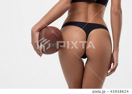 Slim lady booty with rugby ball Slim lady booty with rugby ball 43938624
