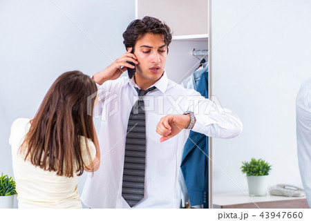 Woman sees her husband off to work  43947660