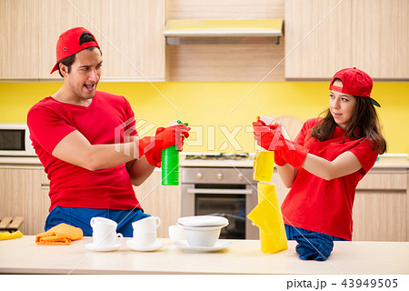 Cleaning professional contractors working at kitchen 43949505