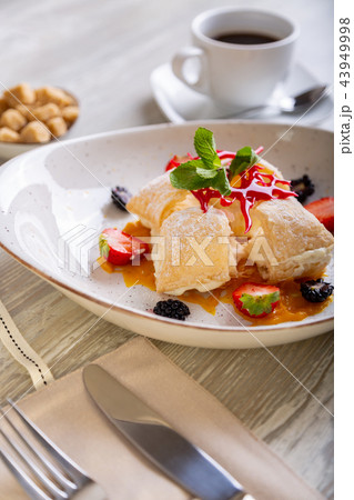 Close up view of beautiful elegant sweet dessert, Napoleon, served on the plate. Beautiful 43949998