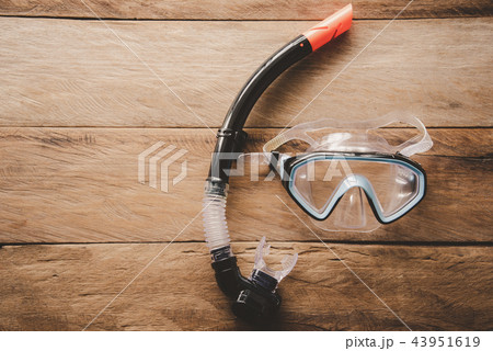 Diving Mask and Snorkel on wooden floor 43951619