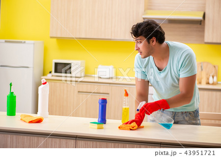 Young handsome man working in the kitchen  43951721