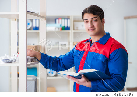 Man working in the postal warehouse Man working in the postal warehouse 43951795