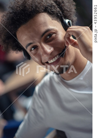 Laughing african american hipster software developer at computer at office of startup company 43952661