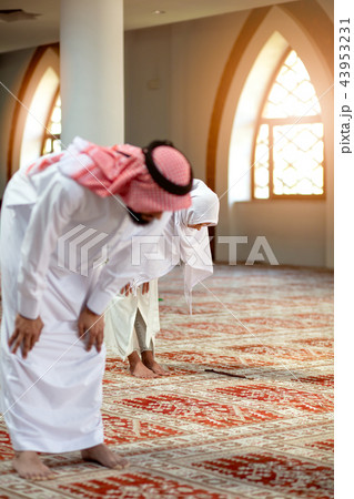 Muslim Praying man and woman in mosque 43953231